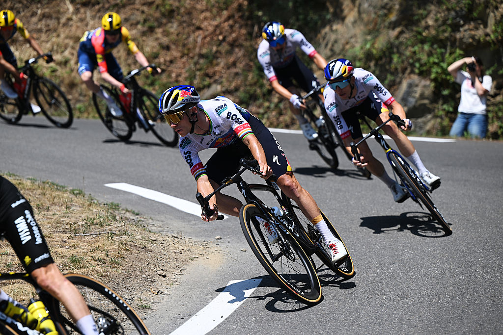 Remco Evenepoel rides down a descent during the 2026 Tour de France, with teammate Florian Lipowitz behind him