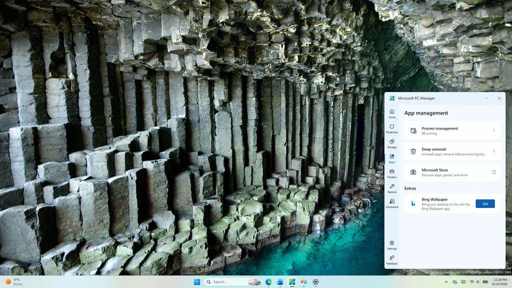 A Windows desktop screenshot showing the Microsoft PC Manager app open to the App Management menu, set against a Bing wallpaper background of basalt sea cave columns.