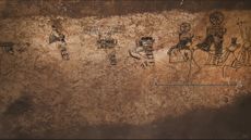 The divine procession panel, digitally highlighted in black, found in the underground complex in Başb&uuml;k, Turkey.