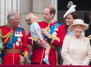 Prince Charles, Prince of Wales, Prince George of Cambridge, Prince William, Duke of Cambridge Catherine, Duchess of Cambridge and Queen Elizabeth II look on from the balcony