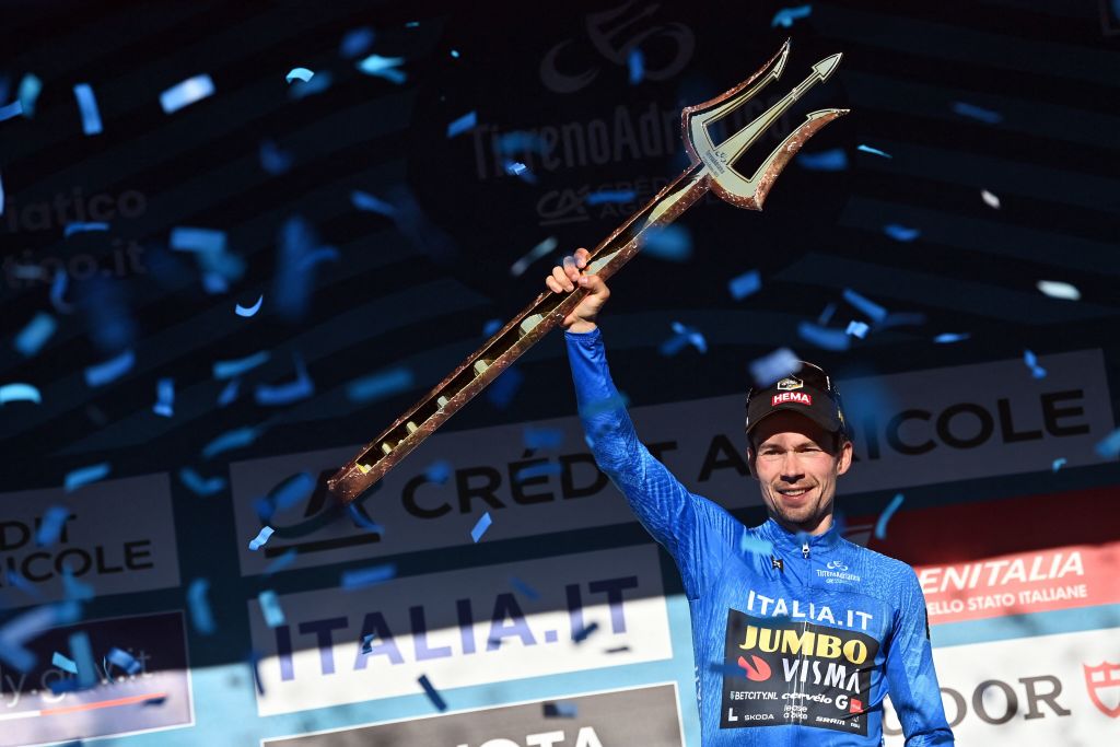 Slovenian Primoz Roglic of Jumbo-Visma celebrates on the podium wearing the blue jersey of leader in the overall ranking after stage 7, the final stage of the Tirreno-Adriatico cycling race, 154 km from and to San Benedetto del Tronto, in Italy, Sunday 12 March 2023. BELGA PHOTO DIRK WAEM (Photo by DIRK WAEM / BELGA MAG / Belga via AFP) (Photo by DIRK WAEM/BELGA MAG/AFP via Getty Images)