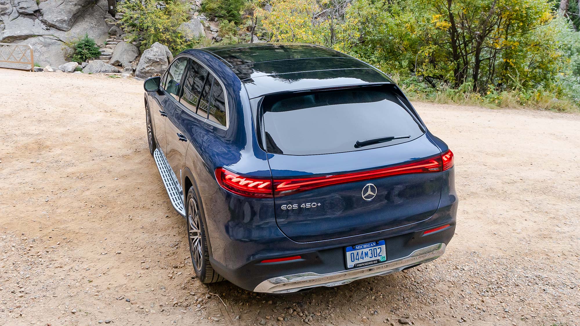 Mercedes EQS SUV parked outside in the woods