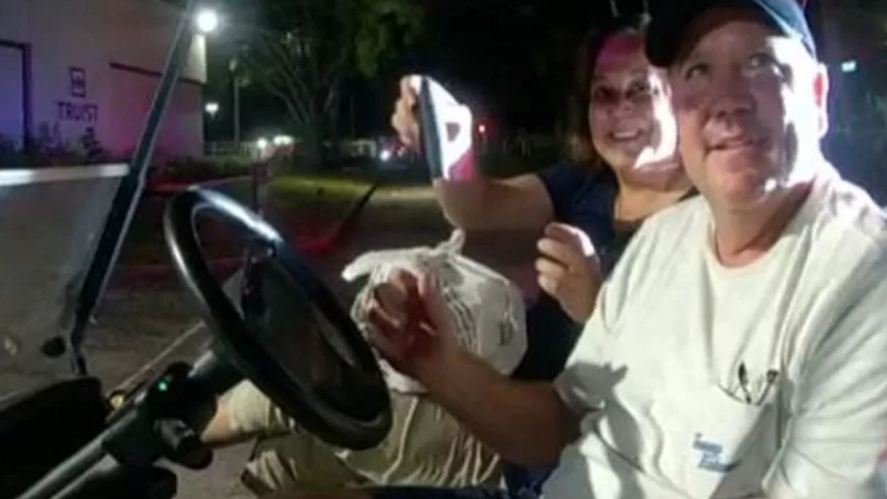 Mary O&#039;Connor and her husband after being stopped in the golf cart