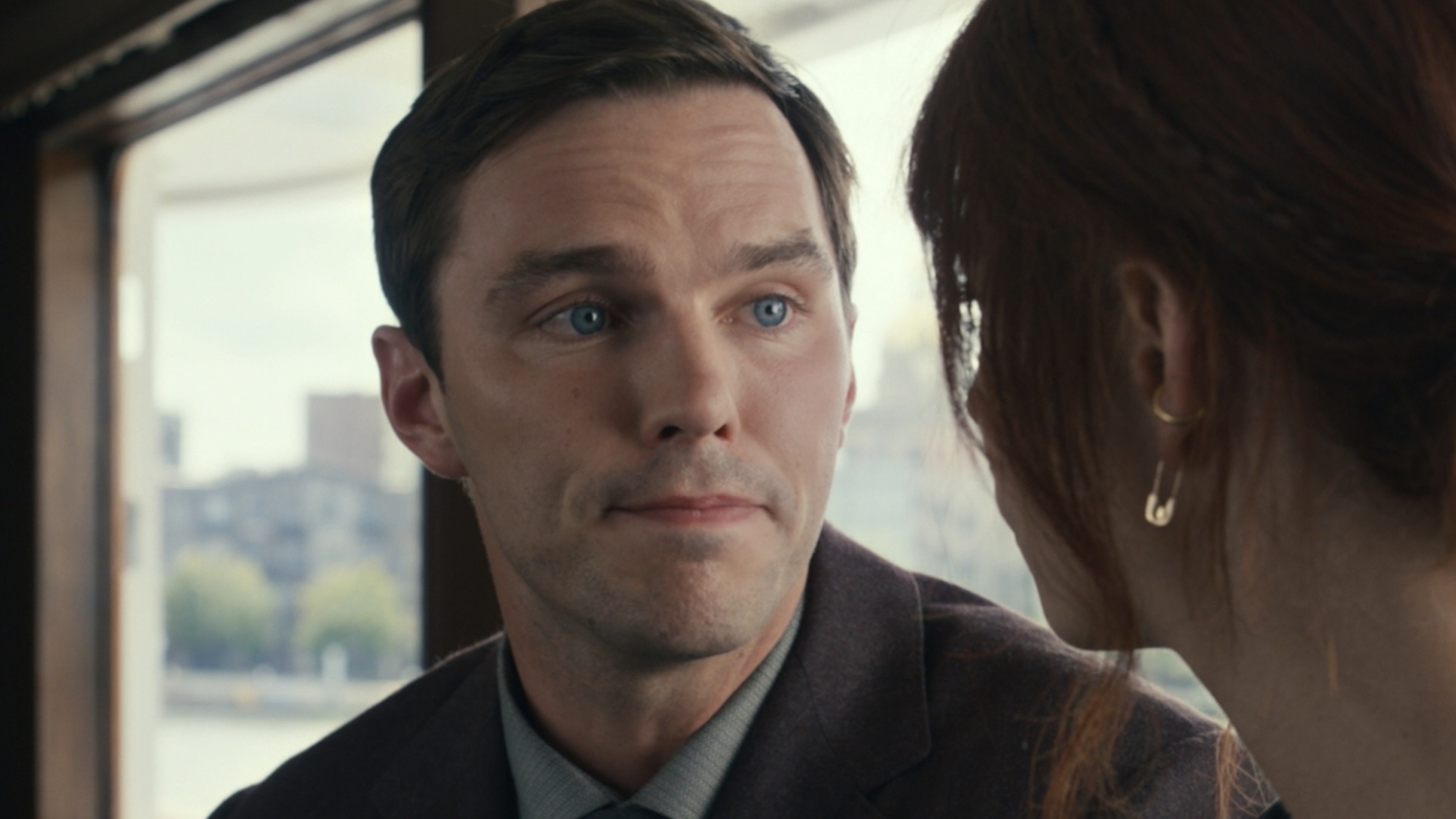 Nicholas Hoult grinning in The Menu. 