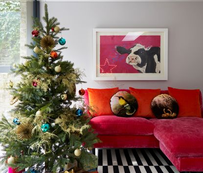 A small living room with a christmas tree