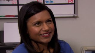 Kelly smiling at Dwight in The Office