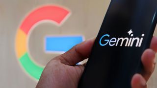 Google Gemini AI logo on a smartphone with Google background