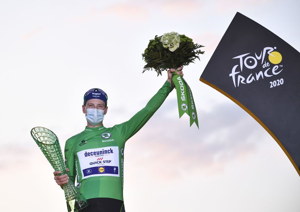 Team Deceuninck rider Irelands Sam Bennett celebrates on the podium after winning the best sprinters green jersey of the 107th edition of the Tour de France cycling race after the 21st and last stage of 122 km between ManteslaJolie and Champs Elysees Paris on September 20 2020 Photo by AnneChristine POUJOULAT AFP Photo by ANNECHRISTINE POUJOULATAFP via Getty Images