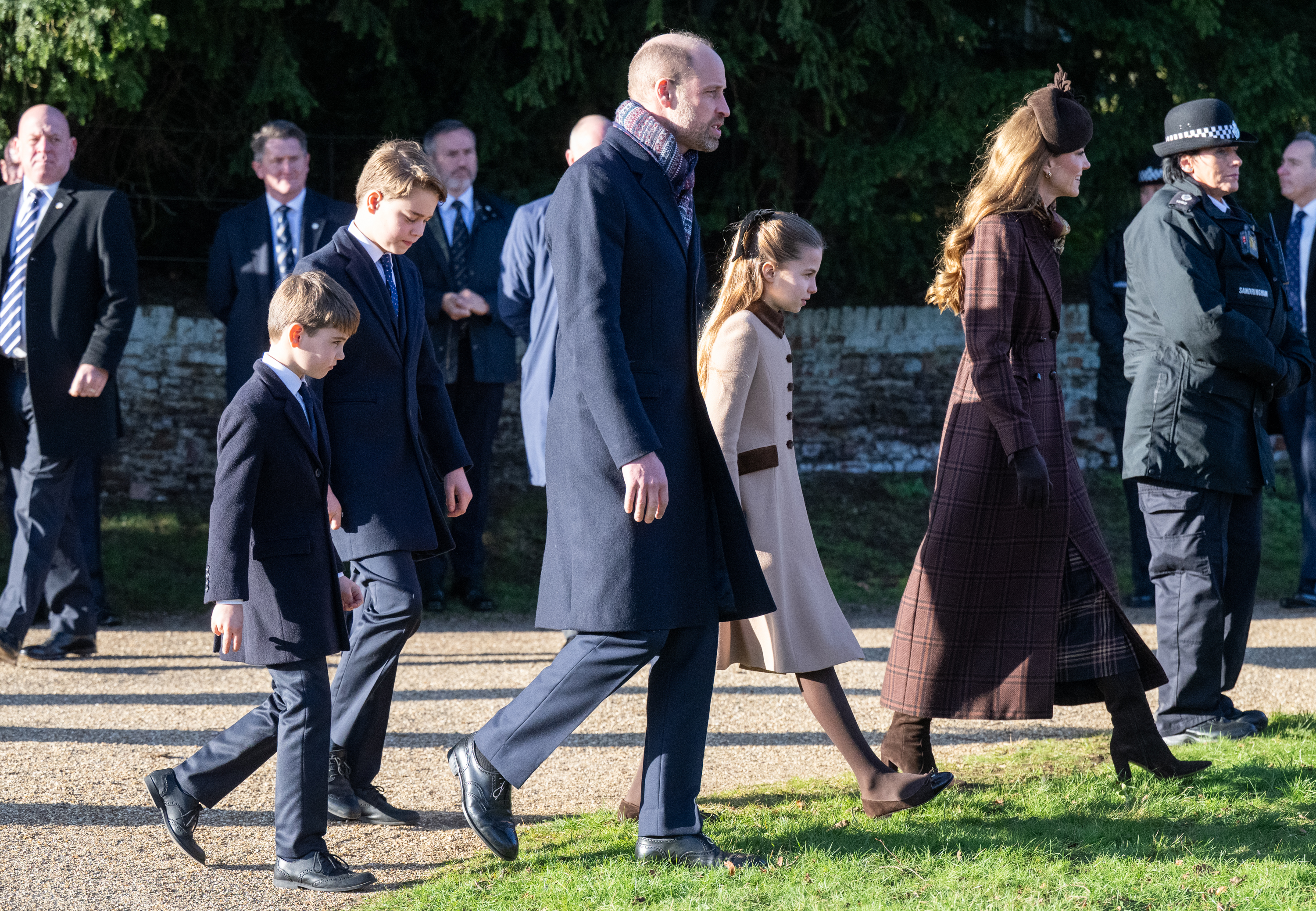 Prince George walking with Prince Louis, Princess Charlotte and Princess Kate to church on Christmas Day