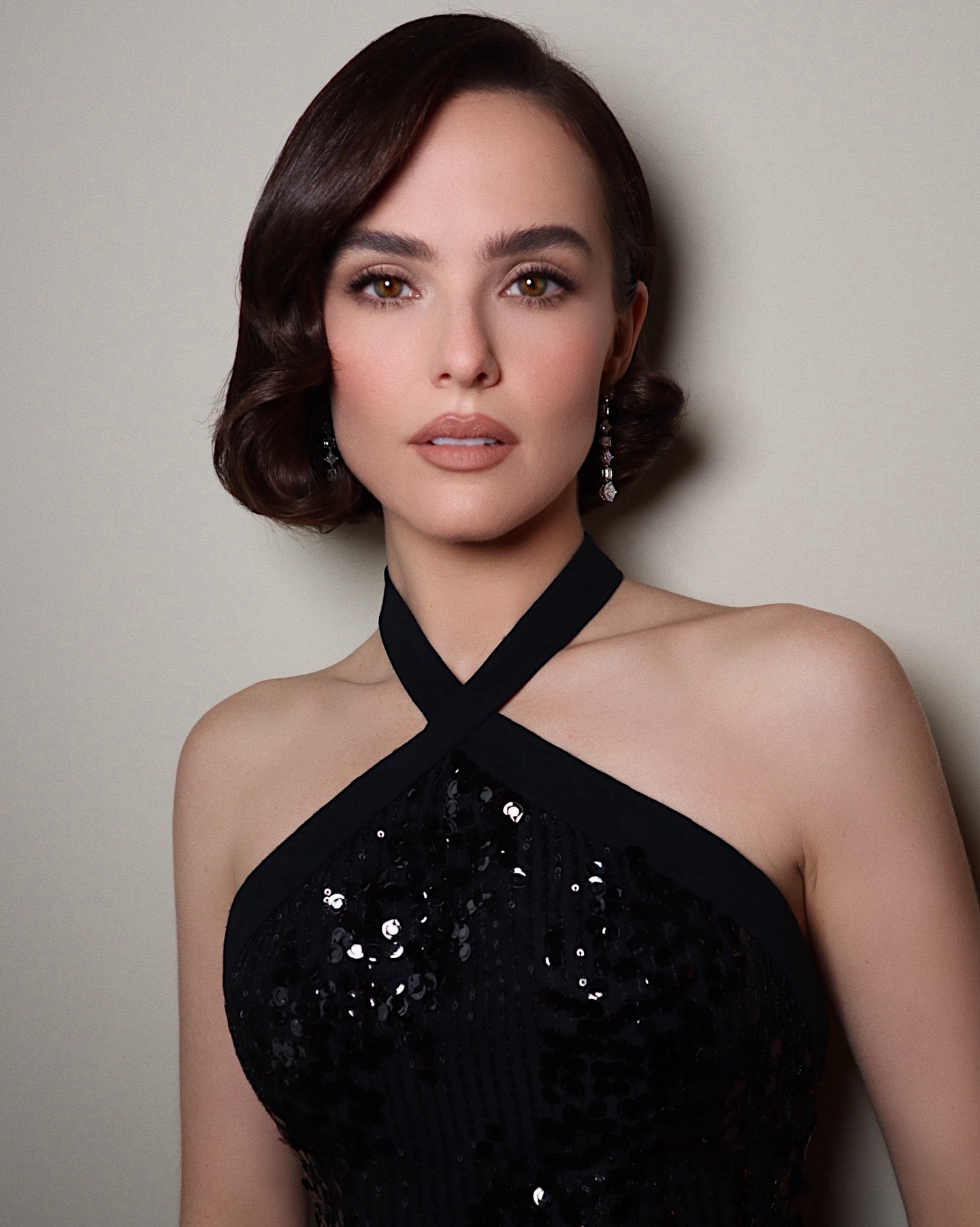 Zoey Dutch wearing a sequin dress with a glamorous bob hairstyle