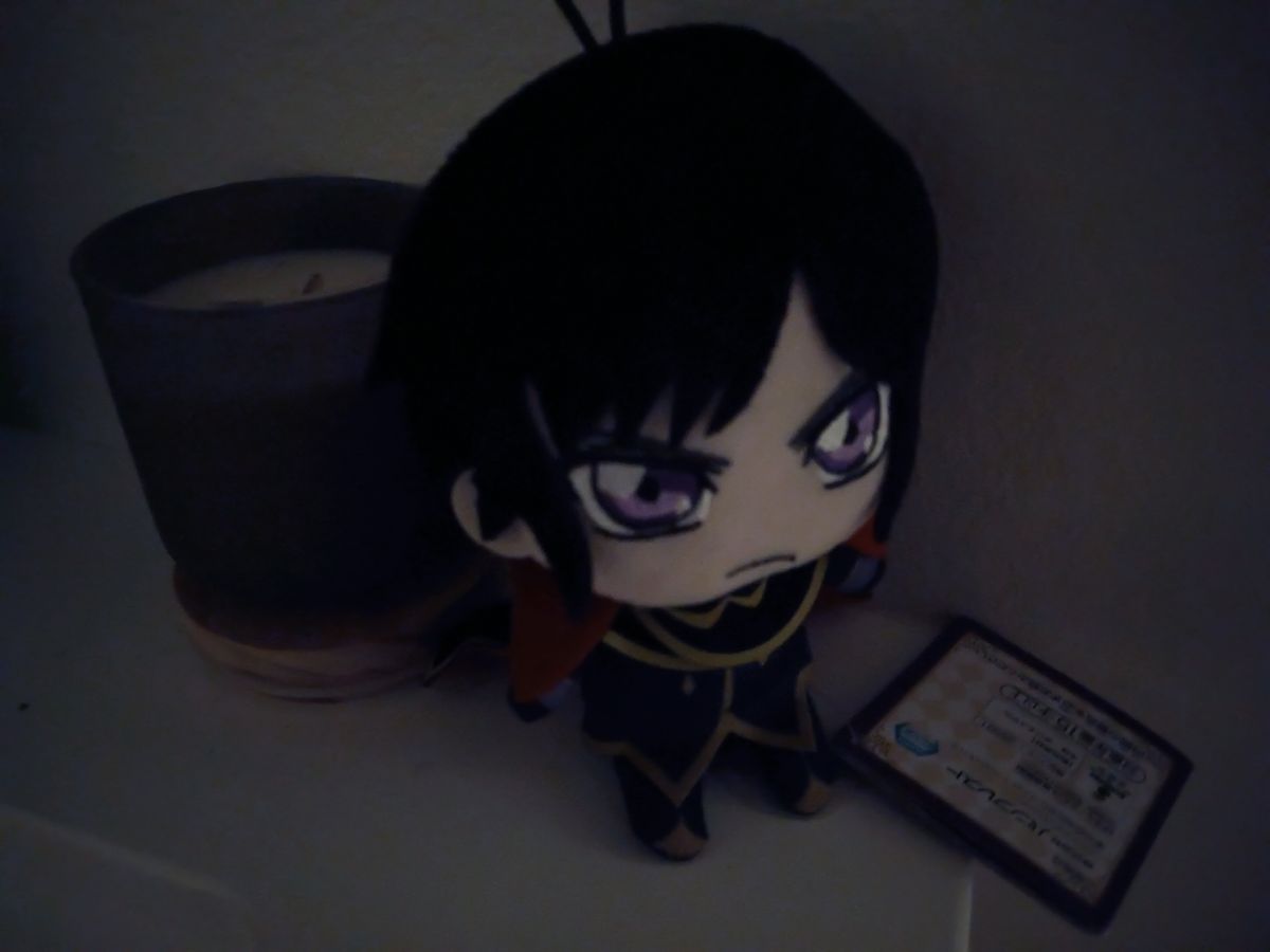 Low-light image of an anime doll