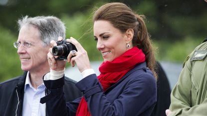 charlottetown, pe july 04 catherine, duchess of cambridge takes photographs as prince william, duke of cambridge takes part in helicopter manouvres called water birding across dalvay lake on july 4, 2011 in charlottetown, canada the newly married royal couple are on the fifth day of their first joint overseas tour the 12 day visit to north america is taking in some of the more remote areas of the country such as prince edward island, yellowknife and calgary the royal couple started off their tour by joining millions of canadians in taking part in canada day celebrations which mark canadas 144th birthday photo by arthur edwards poolgetty images