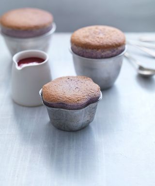 Cherry soufflés in pots with raspberry sauce