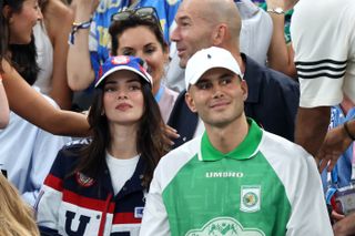 Kendall Jenner attends the 2024 olympics wearing a ralph lauren team USA jacket and hat