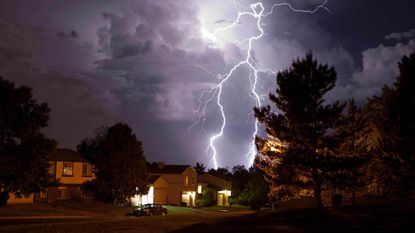 Picture of lightning striking behind house