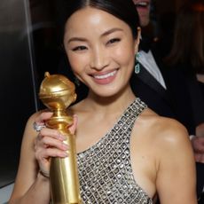 Anna Sawai attends the 2025 Golden Globes after party wearing a sparkling mini dress