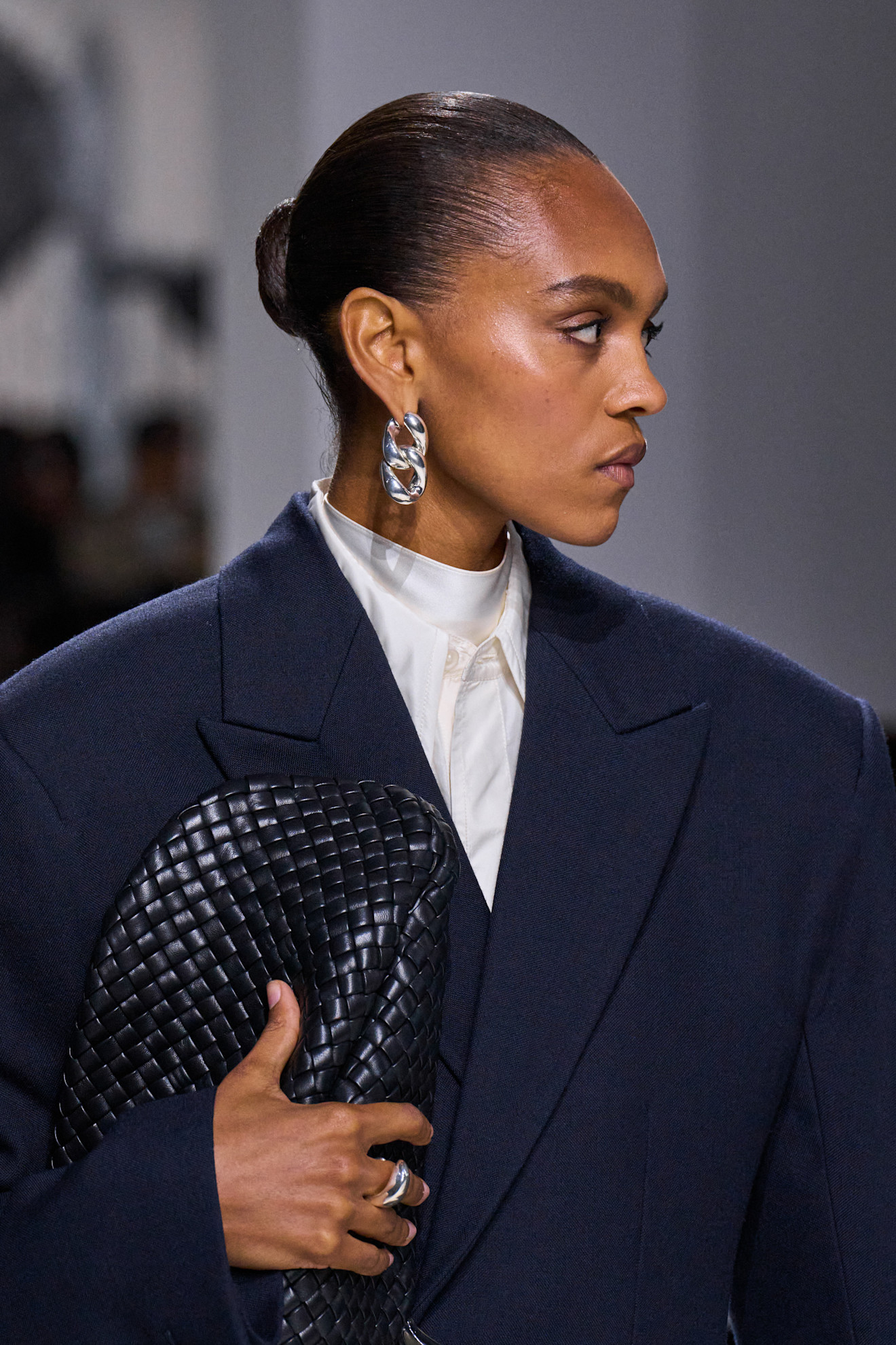 Close-up image of a model at the S/S 26 Bottega Veneta show wearing navy-on-navy.