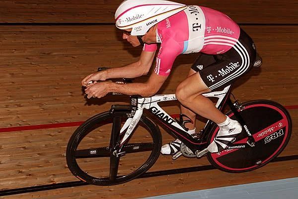 Michael Rogers on the velodrome on a road time trial bike.