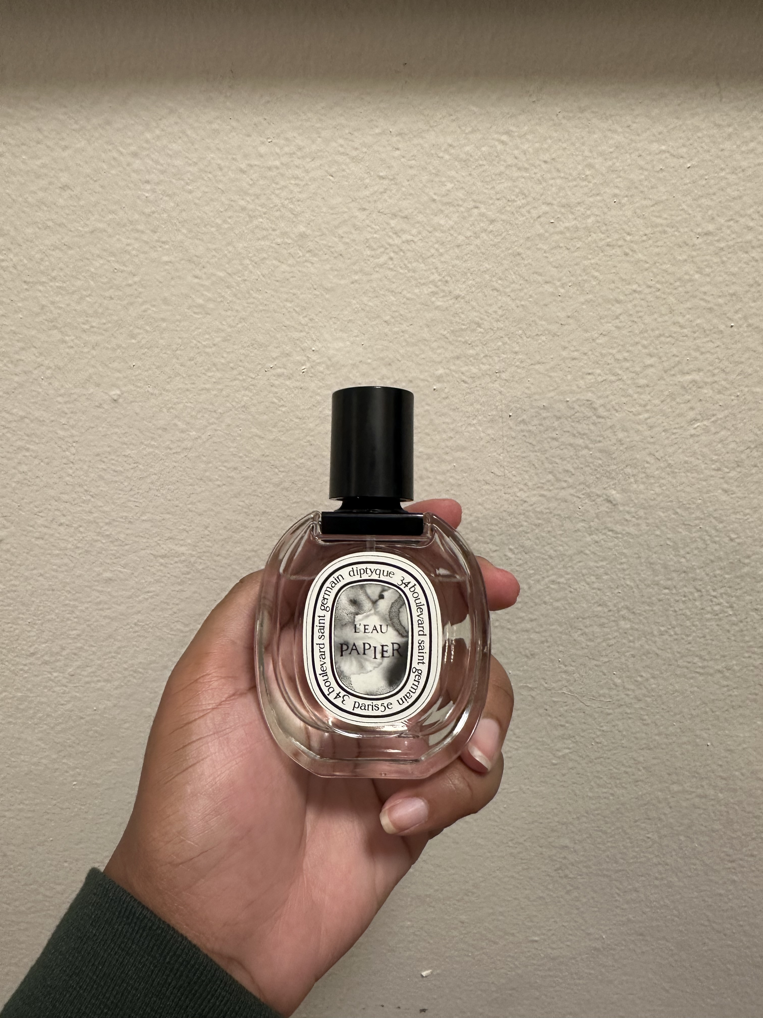 Ariel Baker testing L'eau Papier perfume.