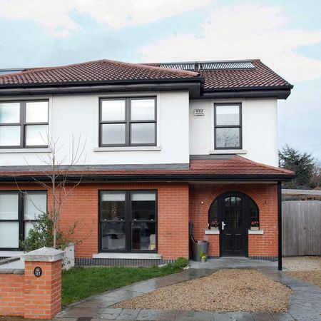 house with sash window and grass