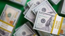 Close up of US $100 bill bundles from high angle of view