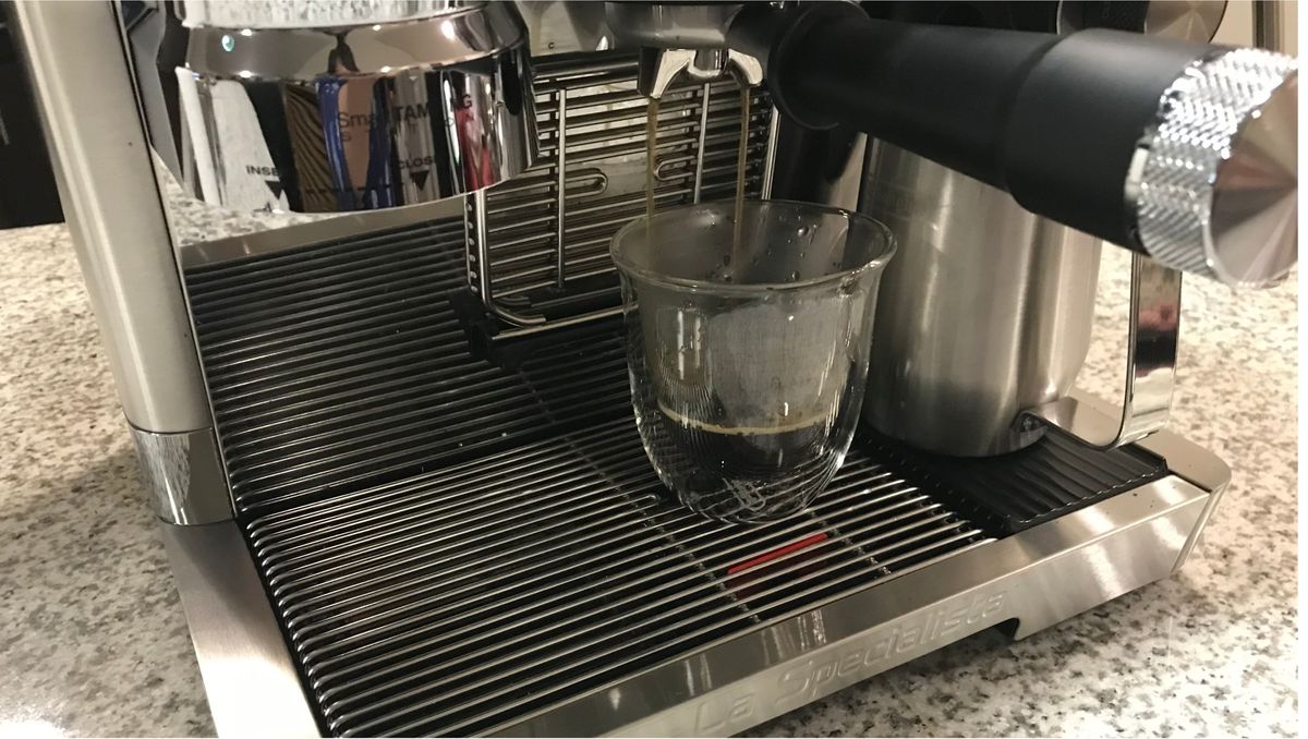 pouring coffee with the De'Longhi La Specialista Maestro