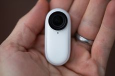 Insta360 Go 2 being held in a hand
