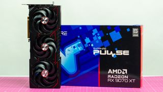 An AMD Radeon RX 9070 XT made by Sapphire on a table with its retail packaging