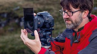 Photographer using an ND grad filter