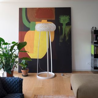 living space with painting and plant pot