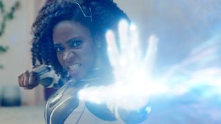Monica Rambeau fires an energy blast at someone off-camera in The Marvels