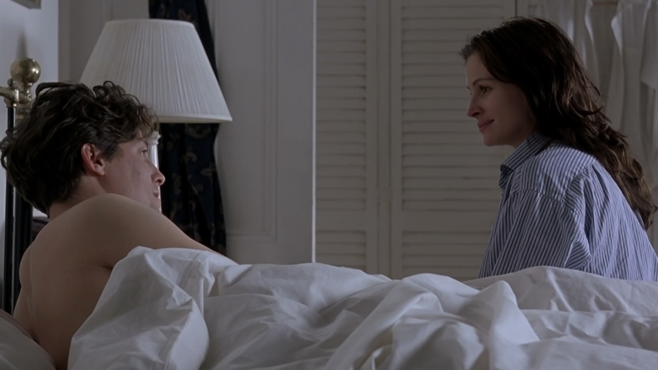 Anna sitting at Will's bedside in Notting Hill