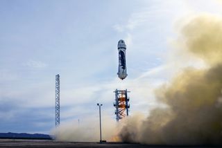 Blue Origin's privately built New Shepard spacecraft launches from the company's West Texas test facility on its first unmanned suborbital spaceflight on Nov. 23, 2015. The capsule parachuted safely back to Earth while the rocket first stage made a succes