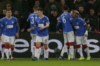 Rangers players celebrate with Alfredo Morelos