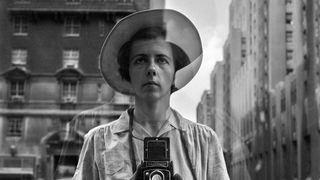 Woman on street with a camera round her neck