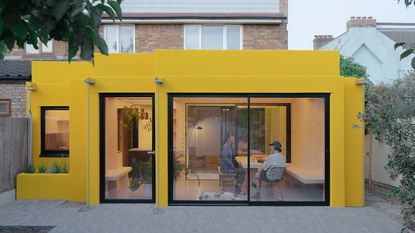 CLT House by Unknown Works, a yellow home and part of the Don't Move Improve 2023 shortlist