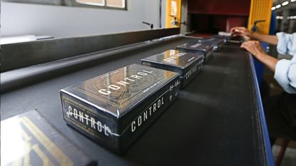 Control board game on production line in factory