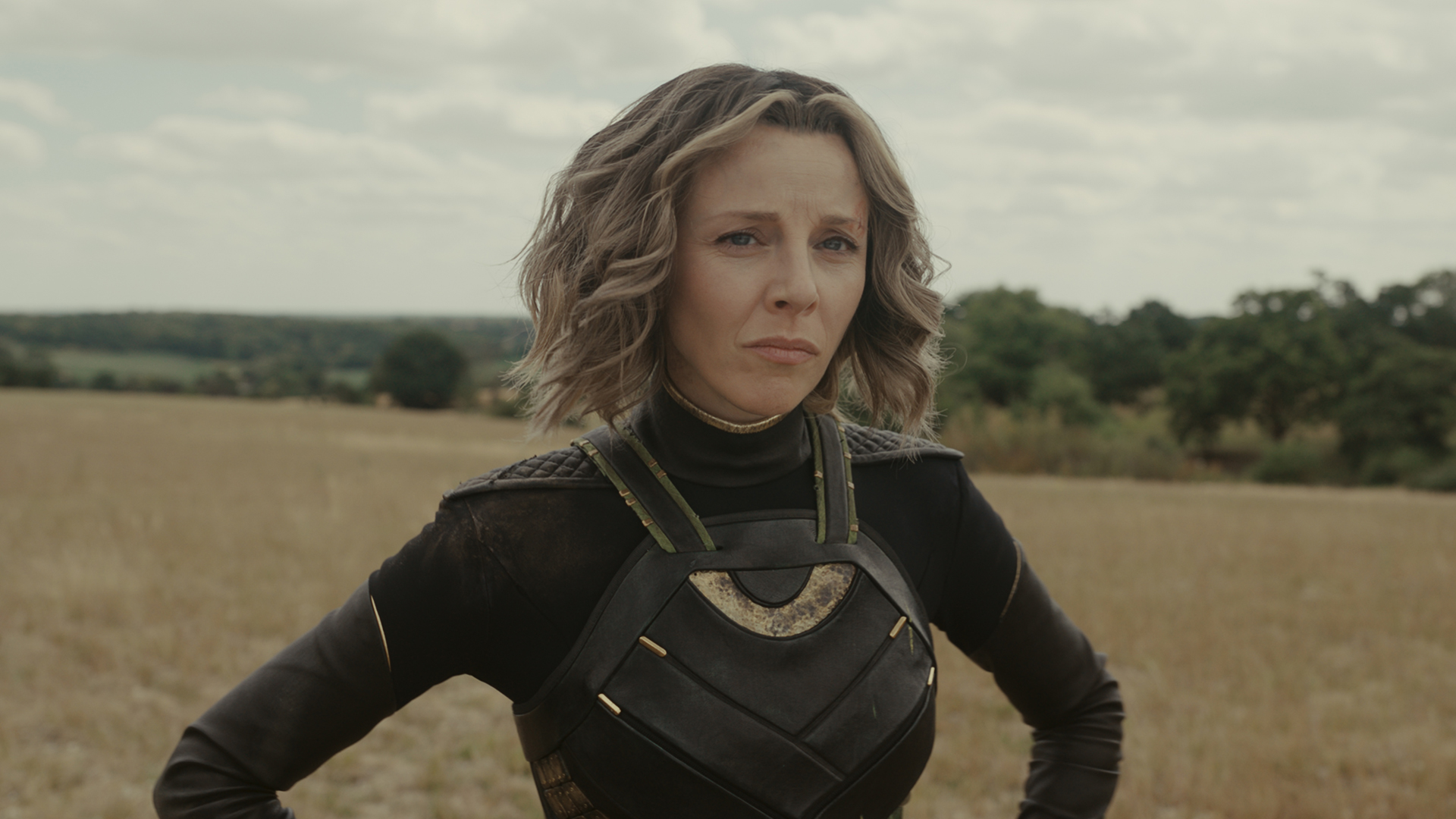 Sylvie stands in a field with her hands on her hips in Loki season 2