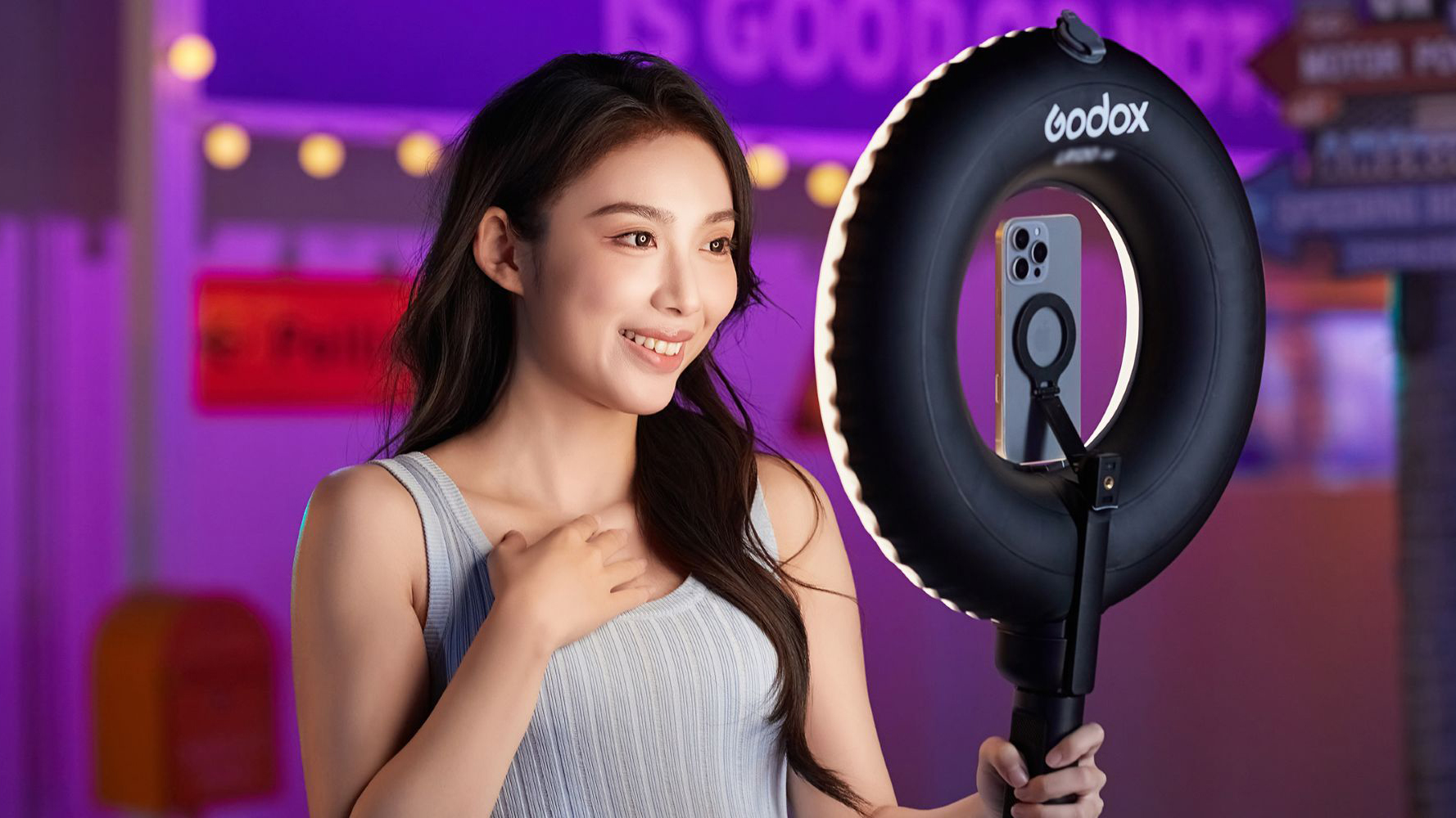The Godox LR150 Air being used as a selfie light with a MagSafe attachment