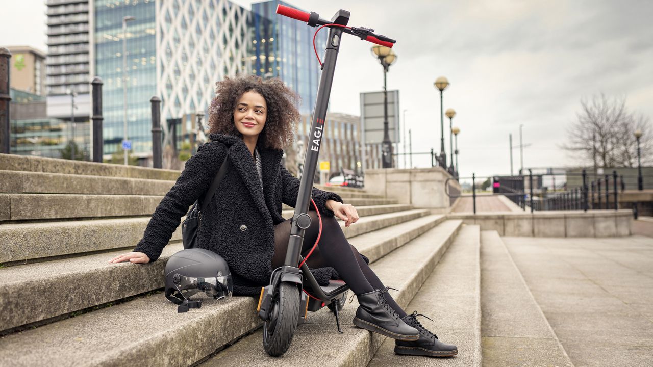 A person using an Eagle Electric Scooter