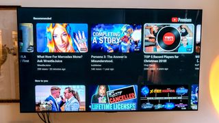 While showing the YouTube home screen, the LG C2 OLED TV has glare on the right side of the screen