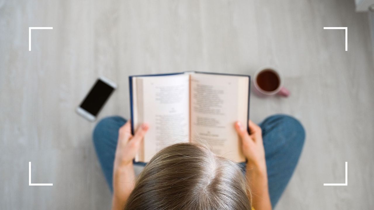 a women reading a book to illustrate our list of the best inspirational poetry quotes