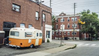 Vintage Camp trailer parked on the street corner in North American city