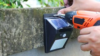 Installing a solar light on wall