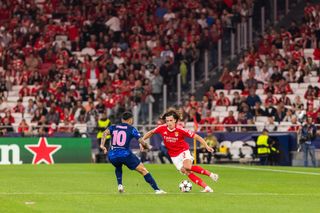 Angel Correa (L) of Atletico Madrid and Alvaro Carreras (R) of SL Benfica seen in action during the UEFA Champions League football match between SL Benfica and Atletico Madrid at Estadio da Luz Stadium. (Final score: SL Benfica 4 - 0 Atletico Madrid).