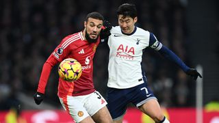 Noussair Mazraoui and Son Heung-Min battle for the ball in a Premier League fixture between Manchester United and Tottenham Hotspur.