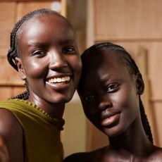 two models smiling and glowing wearing makeup primer