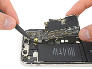 The densely packed double-sided logic board of the iPhone X. Image credit: iFixit
