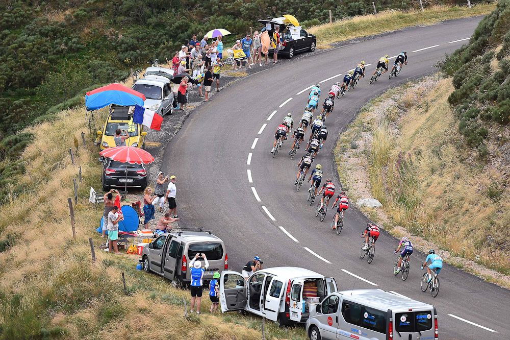 The peloton rolls through the French countryside during stage 15.