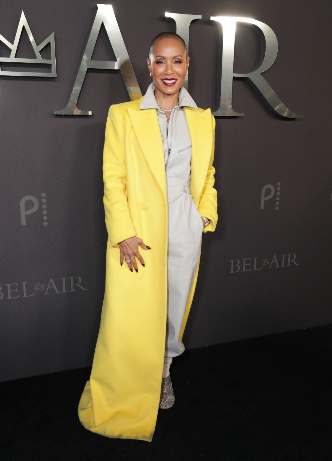 Jada Pinkett Smith wearing yellow coat
